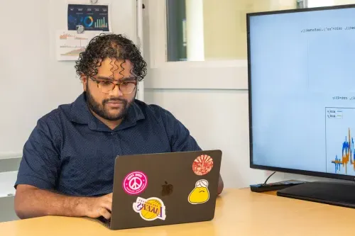 A student studies on their laptop